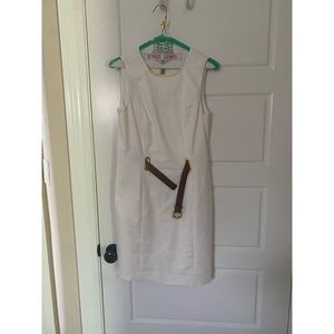 White Michael Kors dress with brown belt and gold embellishments